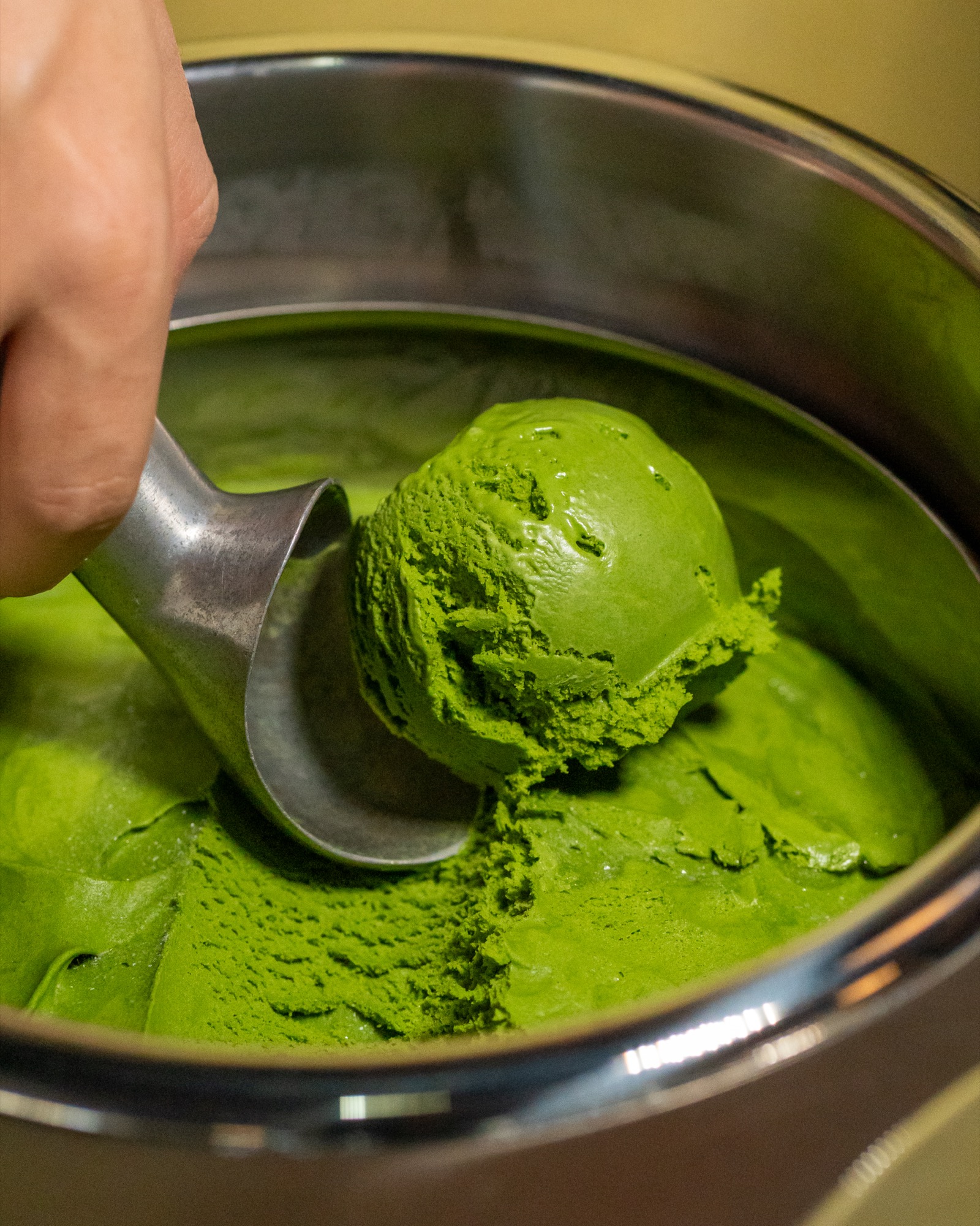 Scooping matcha gelato